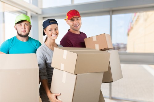 Packing boxes and furniture for a home move in Parsons Green