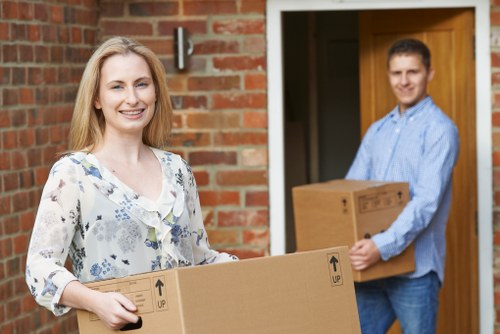 Boxes and furniture being loaded into a removal van