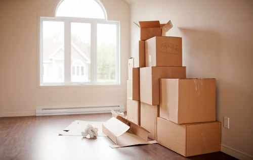Professional movers handling items in a Parsons Green property