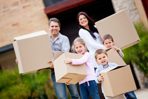 Packed moving boxes and furniture for a local house removal