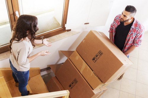 Furniture being carried from a flat in Parsons Green