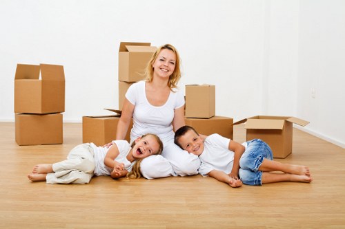 Careful unpacking and room setup in a Parsons Green property