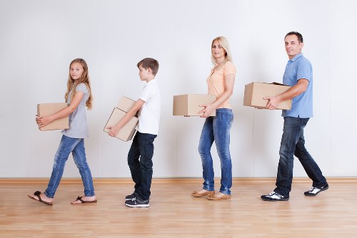 Packed boxes and furniture ready for a local removal service