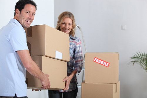 Local movers handling a flat relocation with stairs and access planning